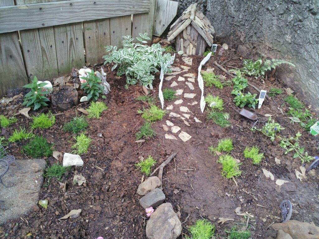 Expect tiny things in small spaces and big things in tiny spaces  on the Highland BLOOMS II Garden Tour- one of our garden hosts tends a Fairy Garden complete with a gnome who stands guard.
